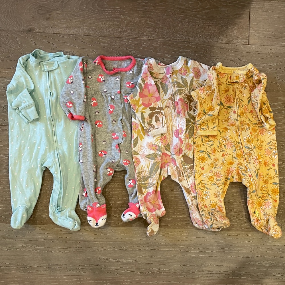 Bundle of girls 3 month footed pajamas.